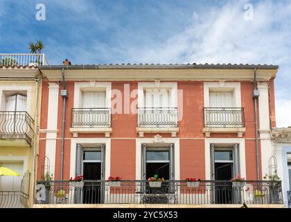 Old house painted in terracotta colour, Meze, Herault, Occitanie, France, Europe Stock Photo