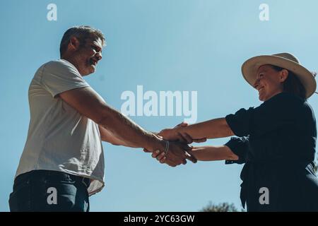 Couple hands held together on blue sky background, close up. High quality photo Stock Photo