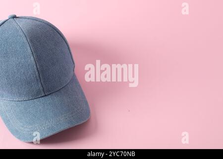 Stylish denim baseball cap on pink background. Mockup for design Stock Photo