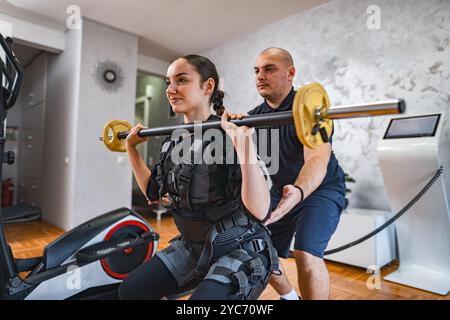 Empowered workout session with support and strength training Stock Photo