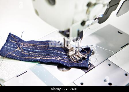 Two-needle sewing machine and piece of fabric Stock Photo