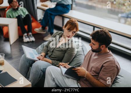 Professor engaging with students in a modern learning environment Stock Photo