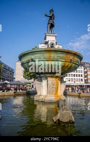 The old market square and an ornate 16th-century fountain, the city's oldest, with a bronze sculpture of King Charles the Great (Charlemagne) in the o Stock Photo