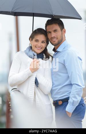 man and woman under umbrella Stock Photo