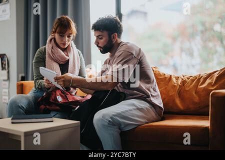 College students studying together on a cozy couch in a common area Stock Photo