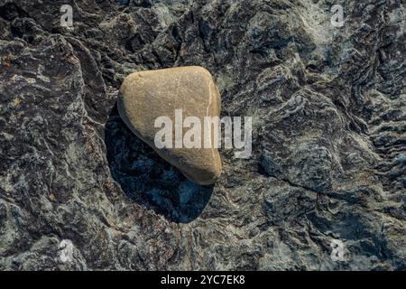 Rocks on the beach at Porth Colmon Llyn peninsula Wales Stock Photo