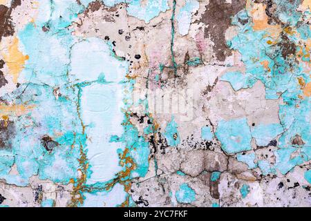 Textured background of rough and irregular wall surface in varied pastel tones, with cracks Stock Photo