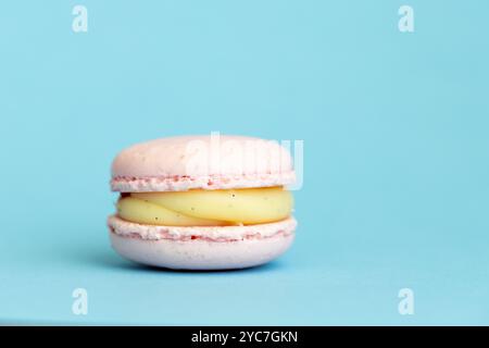 stack of macaroons on plain pink background, tasty almond dessert on bright pink background Stock Photo