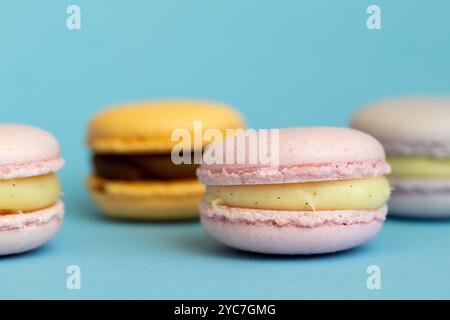 stack of macaroons on plain pink background, tasty almond dessert on bright pink background Stock Photo
