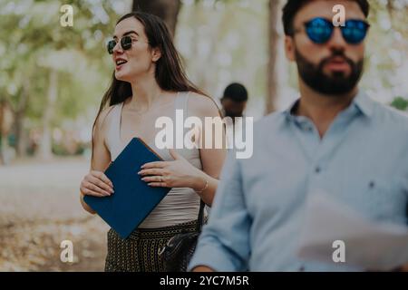 Business people having a casual meeting in a park setting Stock Photo