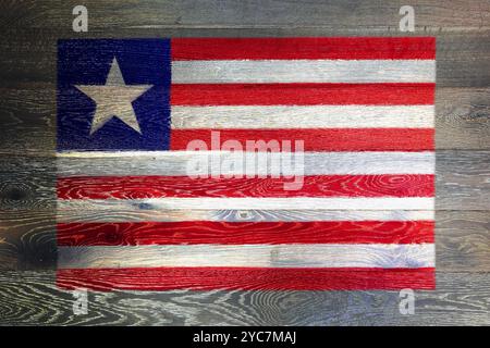 Liberia flag on rustic old wood surface background Stock Photo