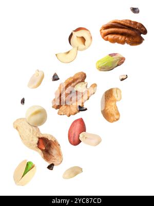 Macadamia and other nuts in air on white background Stock Photo