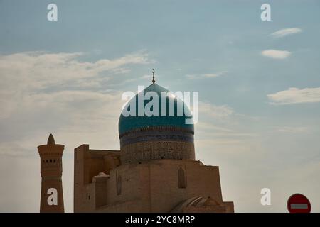 The Poi Kalon Mosque and Minaret, located in the heart of Bukhara, Uzbekistan, is a renowned architectural masterpiece. The grand mosque Stock Photo