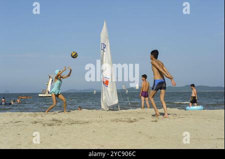 11.08.2012, Wonsan, North Korea, Asia, North Korean beach holidaymakers play with a ball on the beach in the coastal city of Wonsan. In the background Stock Photo