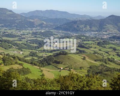 Green pastures and fertile farmlands in the valley below the Napoleon Route at the beginning of the French Camino, St Jean Pied de Port, France, Europ Stock Photo