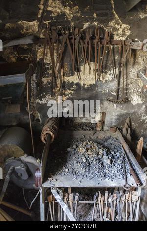 Forging Hardening in a workshop Stock Photo