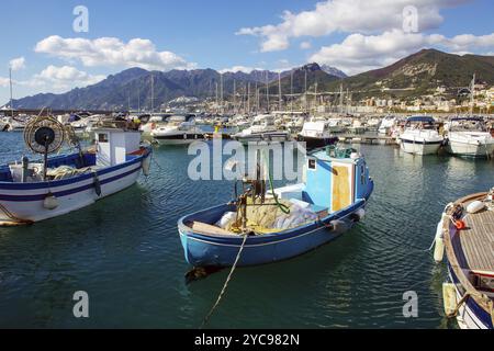 Idyllic view on port (fishing, entertainment, sailing boats in Salerno. A zen-like tranquil sunny day and a view of the Amalfi coast and the mountains Stock Photo