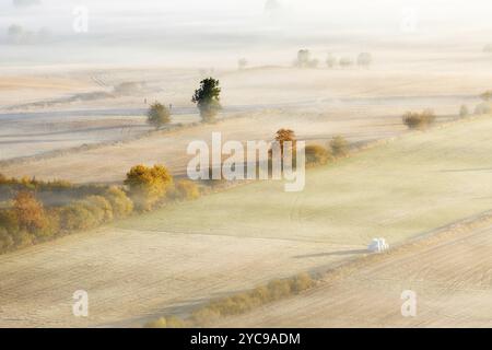 Morning fog in autumn over an agricultural landscape Stock Photo