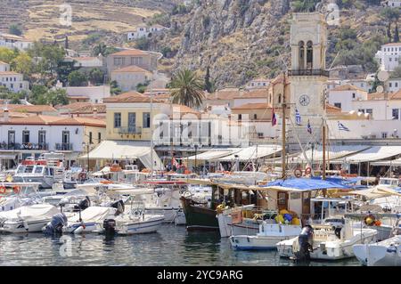 Boats and yachts in the port of Hydra in front of the Clock Tower, Saronic Islands, Greece, Europe Stock Photo