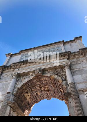 View from the bottom of the Arch of Titus standing in the Roman Forum in Rome, Italy. Stock Photo