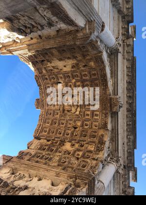 View of the famous Arch of Titus from its bottom in the Roman Forum in center Antique Rome, Italy. Stock Photo