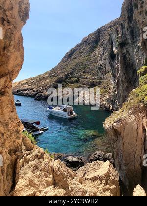 Hidden spot view of the sea and boats in the city Xlendi on the Gozo Island on the Maltese archipelago, Malta. Stock Photo