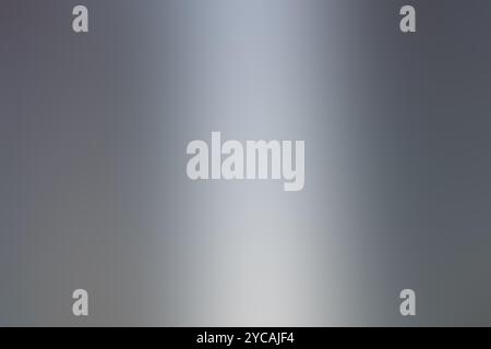 A gray background featuring a smooth gray gradient that transitions beautifully in the middle area of the image for added depth and style Stock Photo