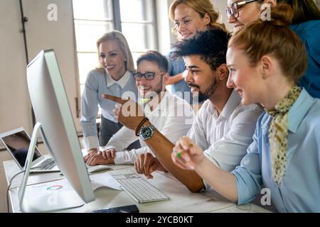 Programmers working in a software developing company office. Business people as a team Stock Photo
