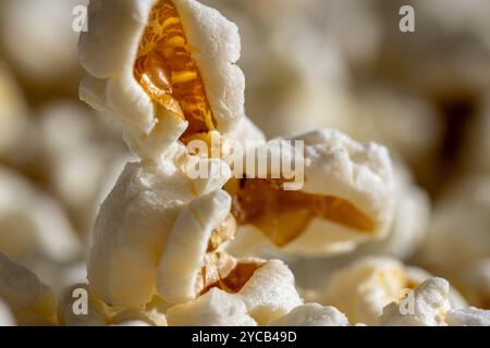 Close-up of freshly-popped popcorn, bringing back memories of fun times at the movies or cozy nights in. Stock Photo