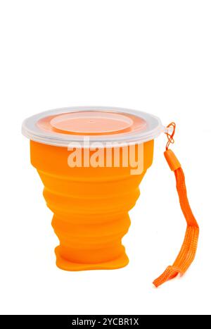 Portable Folding Cup. Multi-function Creative Water. Orange telescopic Cup. Red silicone Cup isolated on white background Stock Photo