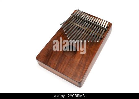 Kalimba or mbira is an African musical instrument. Kalimba made from wooden board with metal isolated on white background Stock Photo