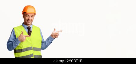 Construction Worker Pointing Fingers Aside Posing On White Background, Panorama Stock Photo