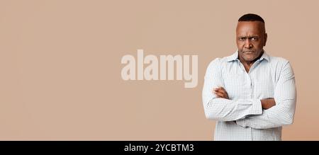 Grumpy mature african american man looking at camera Stock Photo