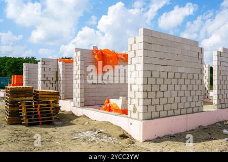 Wall construction of a new residential house from expanded clay blocks, thermally insulated foundations Stock Photo