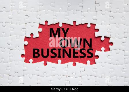 My own Business symbol. Concept words My own Business on white puzzle. Beautiful red background Business and My own Business concept. Copy space. Stock Photo