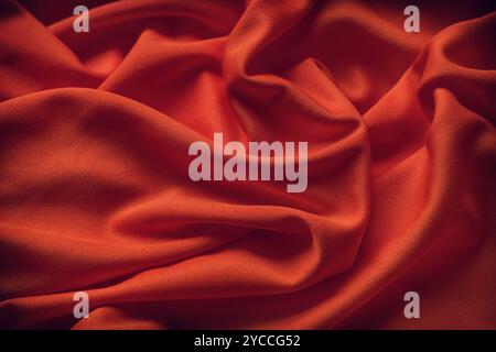 Dark red fabric texture background. Close up. Stock Photo