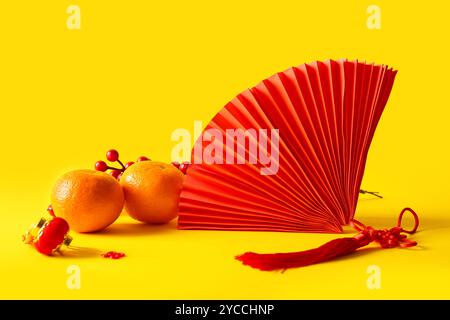 Mandarins and Chinese symbols on red background, closeup Stock Photo ...