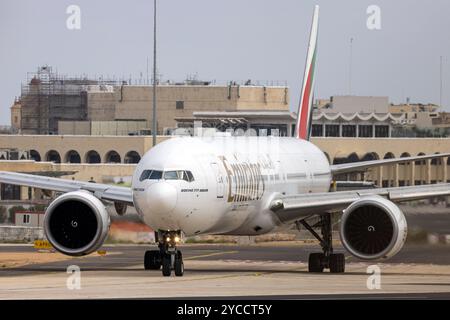 Emirates Boeing 777-36N-ER (REG: A6-EBQ) departing after being grounded for a day due to a fuel leak. Stock Photo