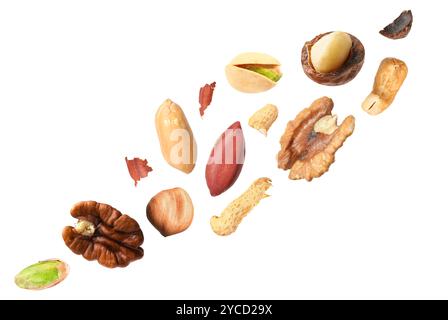 Macadamia and other nuts in air on white background Stock Photo