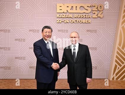 Kazan, Russia. 22nd Oct, 2024. Russian President Vladimir Putin greets Chinese President Xi Jinping prior to a welcoming banquet in Kazan, Russia, Oct. 22, 2024. Xi attended the banquet held by Putin for leaders of BRICS countries at Kazan City Hall on Tuesday. Credit: Shen Hong/Xinhua/Alamy Live News Stock Photo