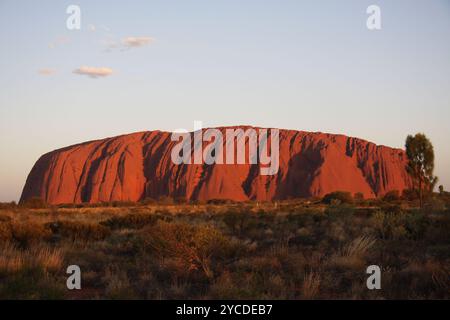 Uluru, or Ayers Rock, is a massive sandstone monolith in the heart of the Northern Territory’s arid 'Red Center'. Stock Photo