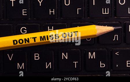 Concept of Don't Miss Out Text written in torn paper Stock Photo