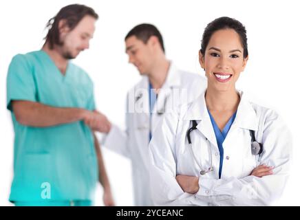 Attractive young doctor smiling, other doctor giving shake hand to male nurse Stock Photo