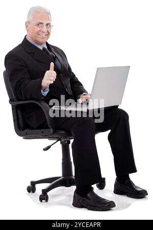 Mature business man shows thumbs up on successful business on white background Stock Photo