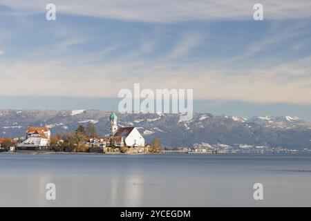 Gentle, wide landscape with lake, St. George's Church and snow-covered Pfaender under a cloudy sky, moated castle, Lake Constance, Bavaria, Germany, E Stock Photo