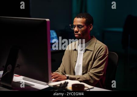 Working Late in Front of Computer Screen Stock Photo