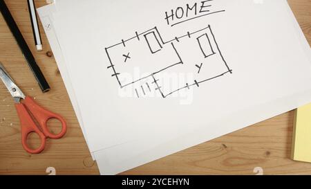 Top view, an interior designer's hand draws an ideal map for a new home, footage ideal for topics such as building renovation, design, new home and fa Stock Photo