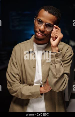 Portrait of African American Man Adjusting Glasses Stock Photo