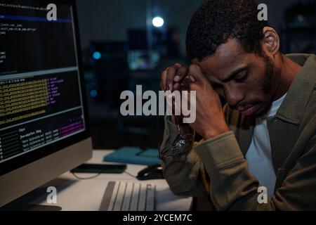 Working at Night with Computer in Office Environment Stock Photo