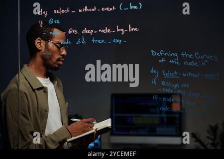 Focusing on Programming with Complex Code on Screen Stock Photo